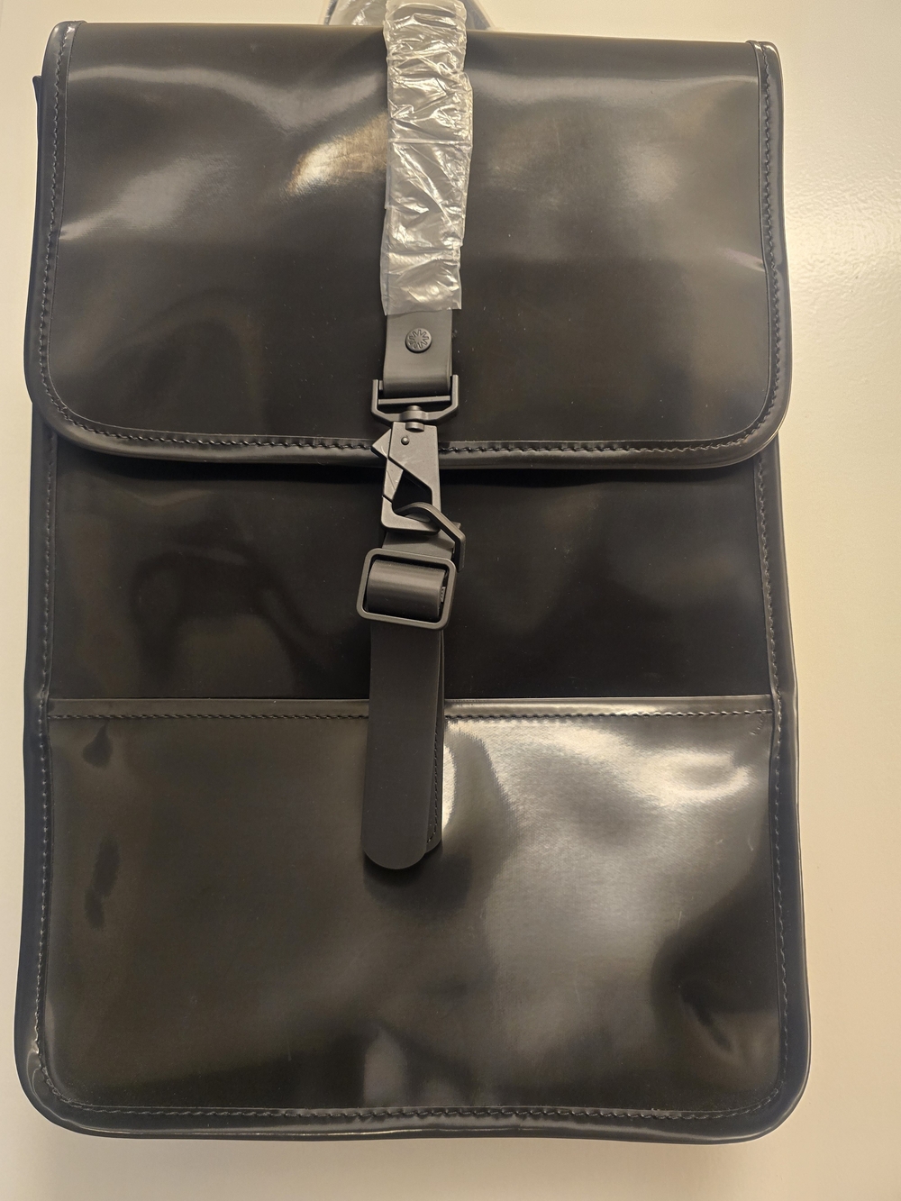 Rains Black Roll-Top Backpack with Front Buckle